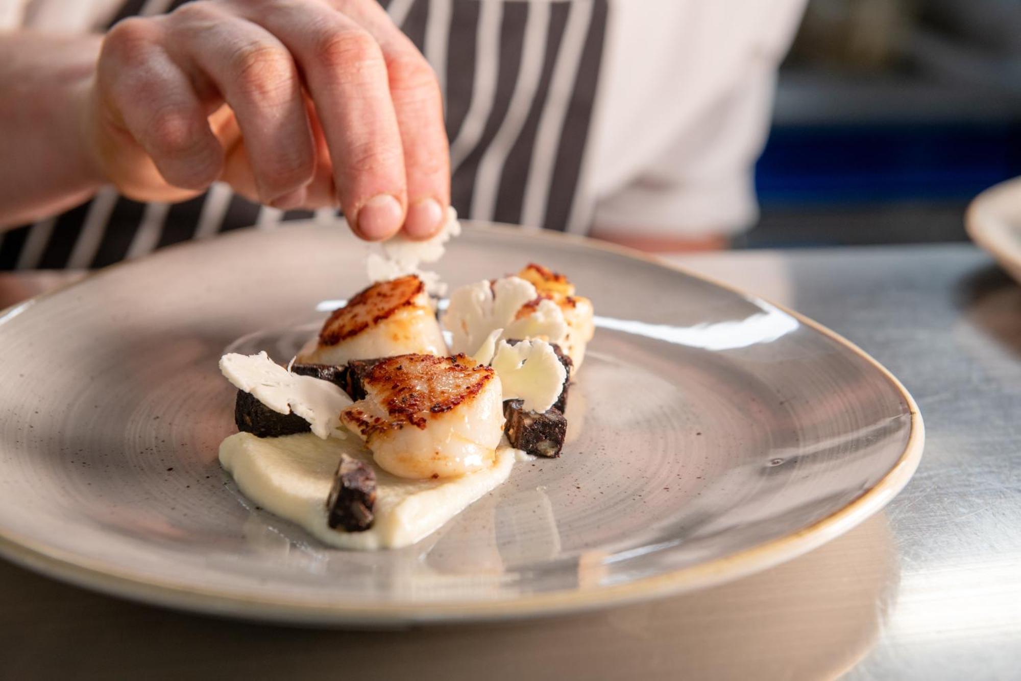 Hotel The Millstone, Mellor Blackburn  Exteriér fotografie A chef finishing a plate of scallops